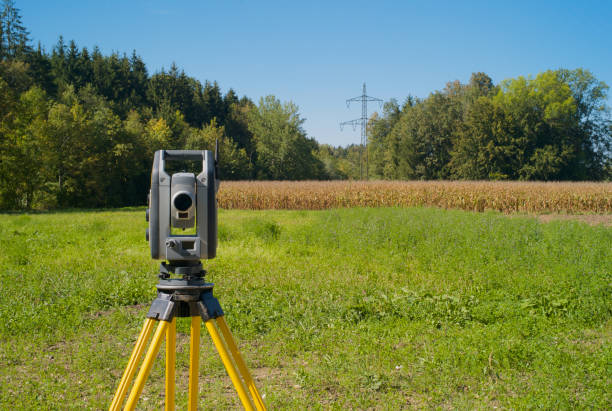 Surveyor placing a boundary marker for HMP Survey & Design